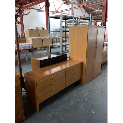 559 - A teak sideboard and matching wardrobe