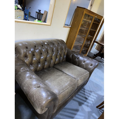 103 - A Thomas Lloyd leather Chesterfield two seater sofa