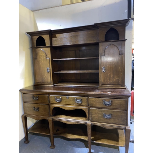 106 - An antique oak high backed dresser