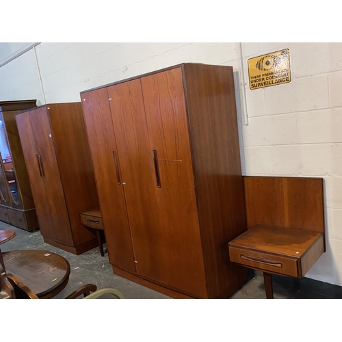 114 - A mid century G Plan Fresco bedroom suite including two wardrobes and a headboard