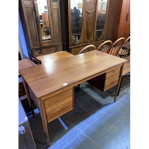 121 - A mid century teak desk