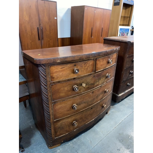 124 - A mahogany bow fronted two over three chest of drawers