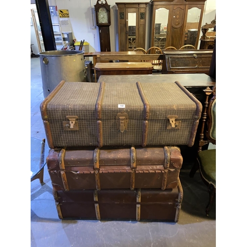 140 - Three wooden bound travel trunks
