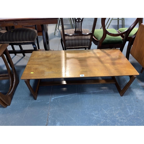 145 - A mid century teak coffee table