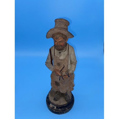 190 - A Victorian figure of a man holding a broom with original paper label for William Whiteley, Westbour... 