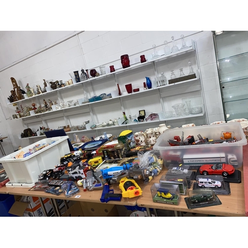 38 - A collection of boxed matchbox, Burago etc model cars ,planes, playworn model vehicles and toys