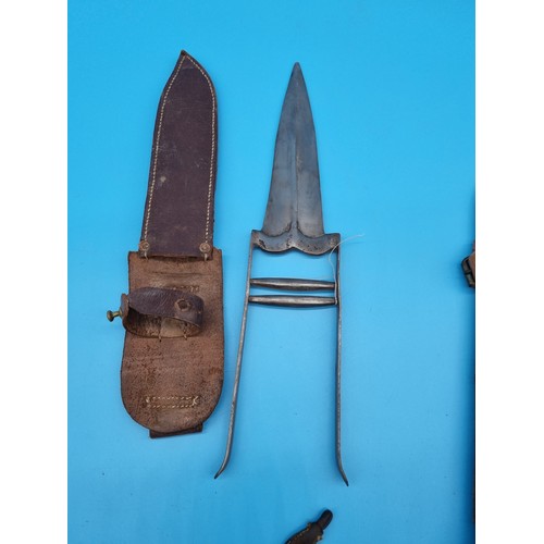 166 - A Fairbairn Sykes Commando fighting knife in original scabbard (tip of the dagger is missing) togeth... 