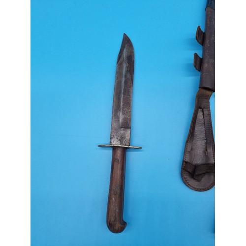 166 - A Fairbairn Sykes Commando fighting knife in original scabbard (tip of the dagger is missing) togeth... 
