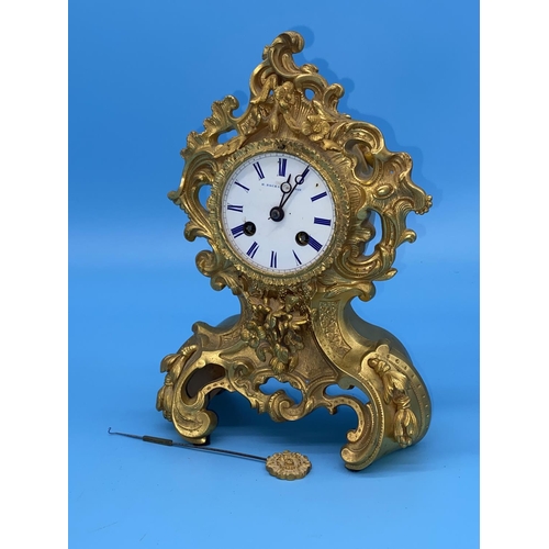 173 - A large 19th century gilt metal mantle clock by H. Rochat of Paris- The dial with romans numerals- R... 