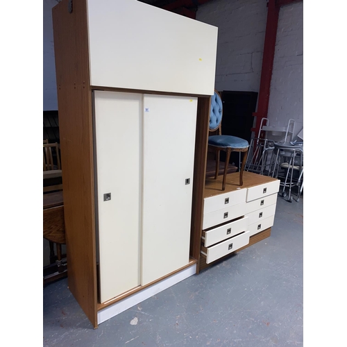 551 - A double chest of drawers, wardrobe and a bedroom chair