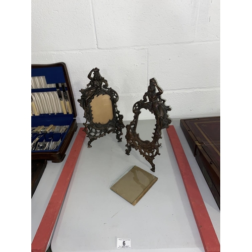 6 - A pair of cast iron picture frames with lady and cupid figures and a bronze finish