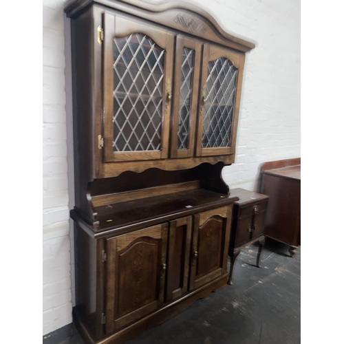 412 - An oak dresser and a bedside cabinet