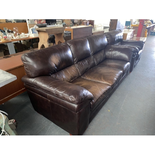 474 - A brown leather three seater sofa and a matching armchair