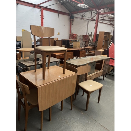 478 - A retro sideboard, drop leaf kitchen table and four chairs