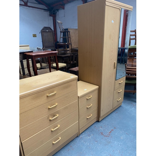 484 - A modern wardrobe, chest of drawers and bedside cabinet