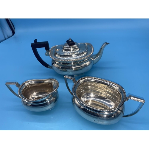 136 - A hallmarked silver 3 piece tea set; teapot, cream/milk jug & bowl - Chester- Barker Bros 1924 -950g