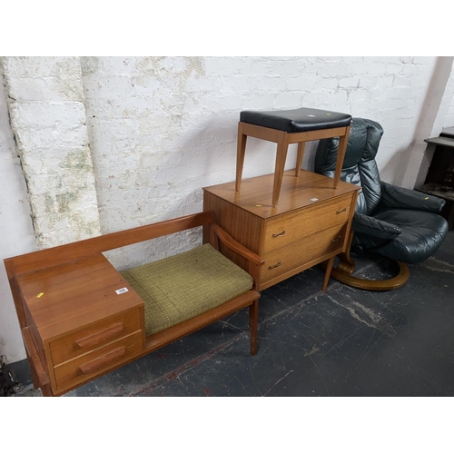 308 - A telephone table, two drawer chest of drawers, a stool, mid century green leather swivel chair with... 