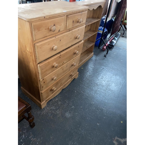 318 - A two over four pine chest of drawers and a pine bookcase