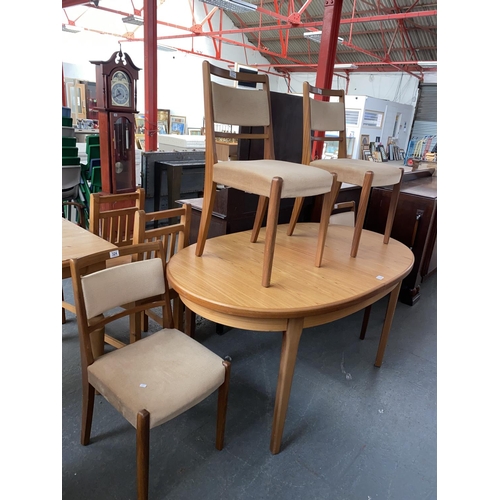 324 - An extending dining table and four chairs