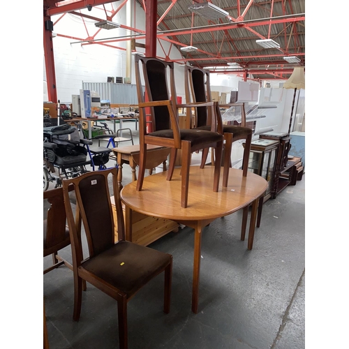 340 - A extending dining table and four chairs