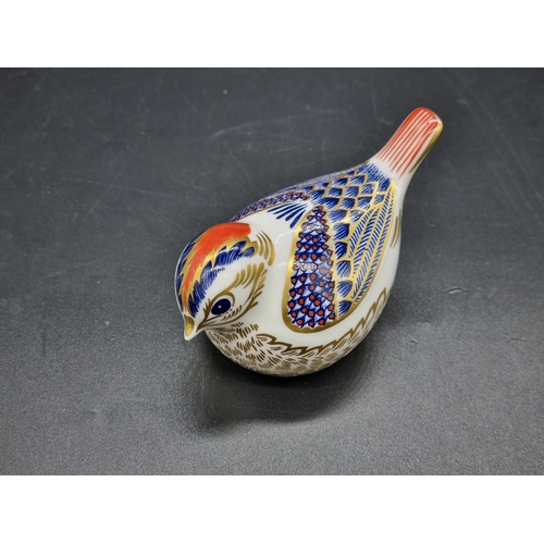 325 - A Royal Crown Derby bird paperweight with gold stopper