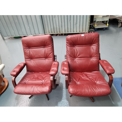 182 - Two red leather armchairs