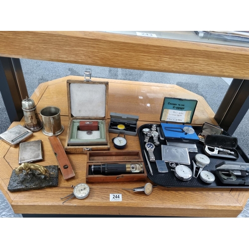 244 - A vintage lot to include levels, engineering gauges, silver plated items, watched, a vintage Nero La... 