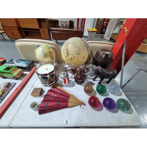 59 - A vintage lot to include a barrel shaped Remy Martin games compendium, paper weights, 2 globe lamps,... 
