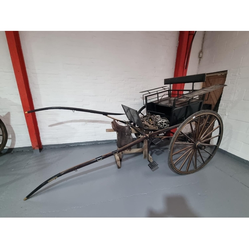 145 - A Victorian horse drawn governess cart with tack to include reins, saddle, etc