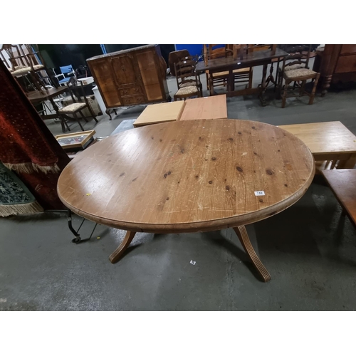 749 - An extending oak dining table