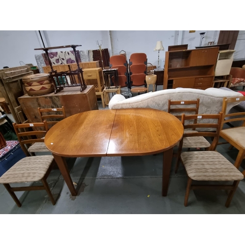 772 - A mid-century style teak dining table and 4 chairs