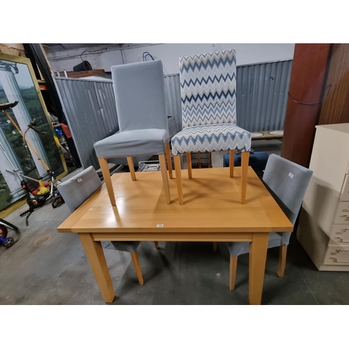 794 - A pine effect dining table and 4 chairs