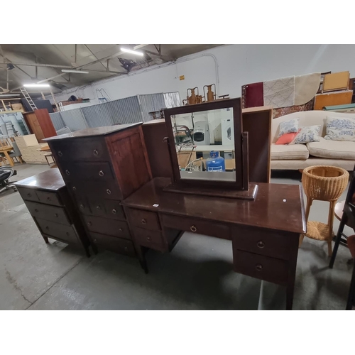 808 - A mahogany dressing table with mirror, a 2 over 2 chest of drawers and an 8 drawer chest of drawers