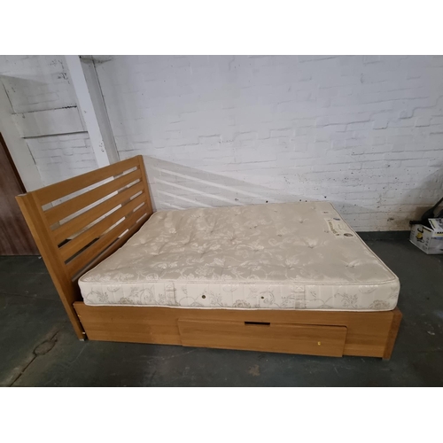 816 - An oak double bed frame with a Sleepeezee double mattress