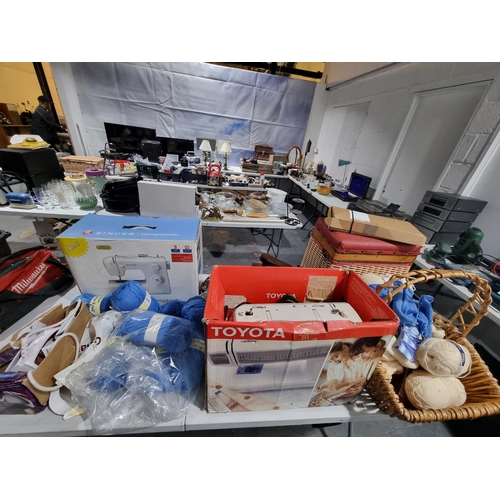 906 - 2 x sewing machines and a collection of sewing materials and a sewing box