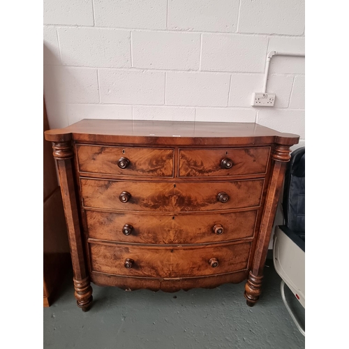 153 - A bow fronted mahogany two over three chest of drawers