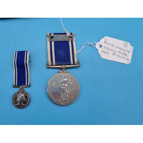 238 - A Police Exemplary Service Medal and miniature in original medal box - EIIR