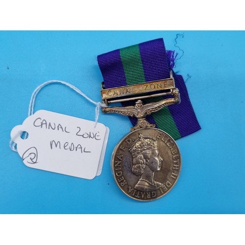 239 - A Queen Elizabeth II Canal Zone medal in original cardboard medal box, presented to 22648574 GNA D. ... 