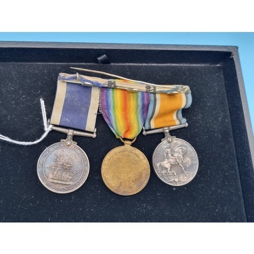 240 - A group of three medals awarded to PTE H. R. Lynch 67377. The Long Service and Good Conduct George I... 