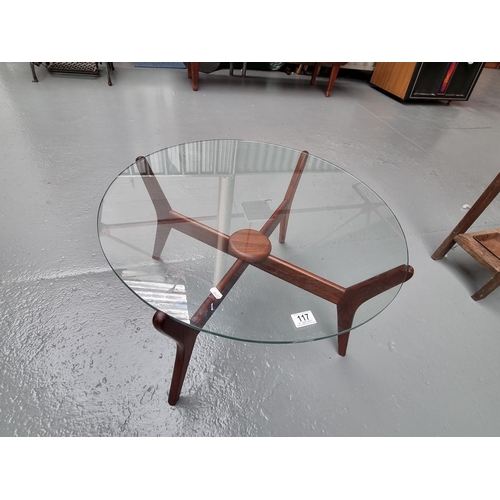 117 - A mid century glass top circular coffee table