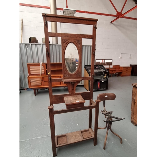 118 - An oak hallstand and a Tansad adjustable stool (missing seat)