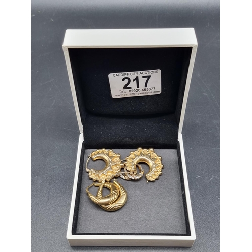 217 - Three pairs of 9k gold earrings (combined weight 8.2 grams)