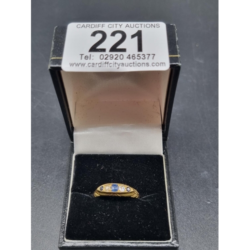 221 - An 18k gold and sapphire ring (3.4 grams including stones)