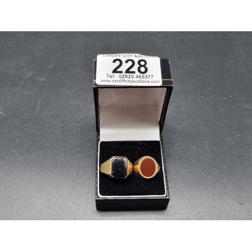 228 - Two 9k gold gents signet rings - one being Onyx and the other blood stone (total weight 8.1 grams)