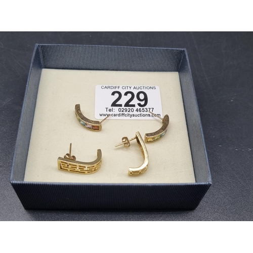 229 - Two pairs of 9k gold pierced earrings (7 grams including stones)