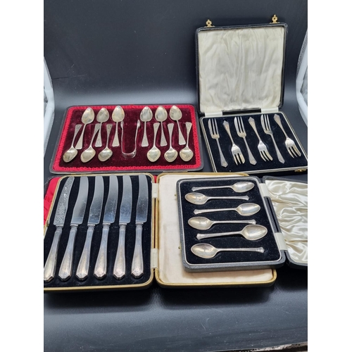 242 - A boxed set of six hallmarked silver teaspoons, a boxed set of six hallmarked silver cake forks, a b... 