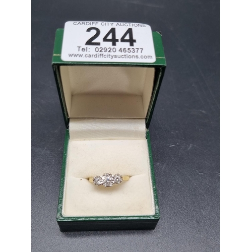 244 - An 18k gold engagement ring with 3 diamonds (.3 carat)