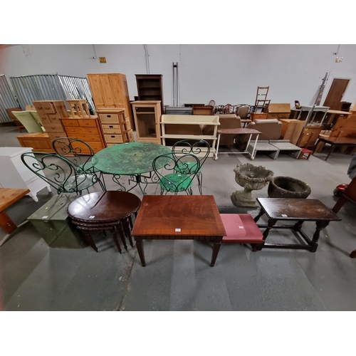 385 - A mahogany nest of tables, oak side table, metal money box, etc