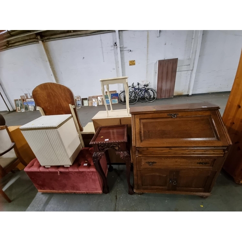 389 - An oak bureau, a mahogany plant stand, an ottoman, etc