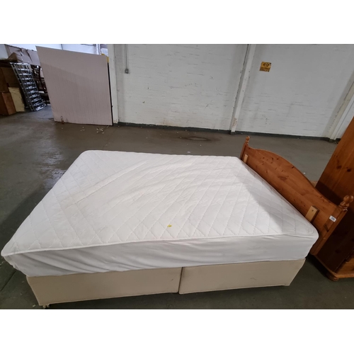 396 - A double divan bed with pine headboard and mattress